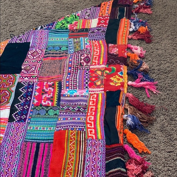 Shawls are handmade work from northern Thailand. ￼